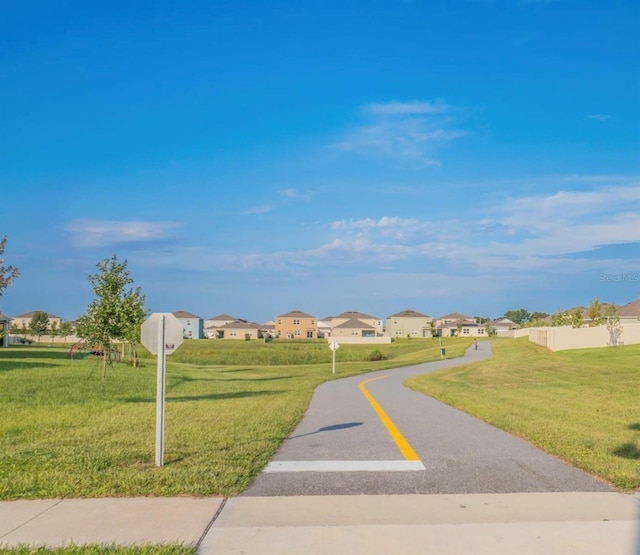 surrounding community featuring a yard