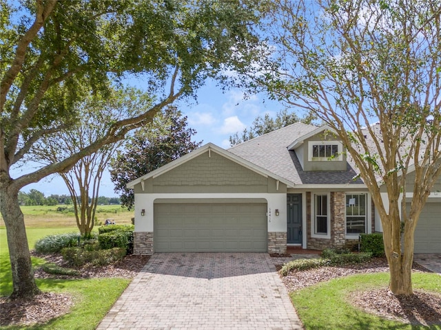 craftsman house with a garage