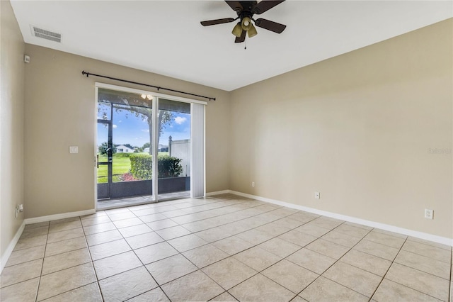 empty room featuring ceiling fan and light tile patterned flooring