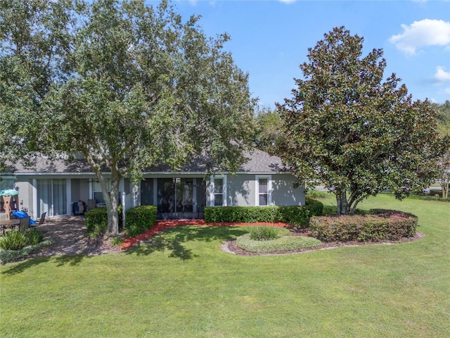 view of front of home with a front lawn