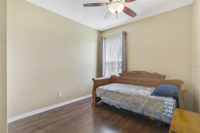 bedroom with ceiling fan and dark wood-type flooring