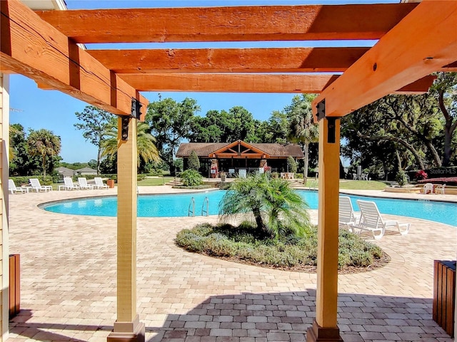 view of pool featuring a pergola and a patio area