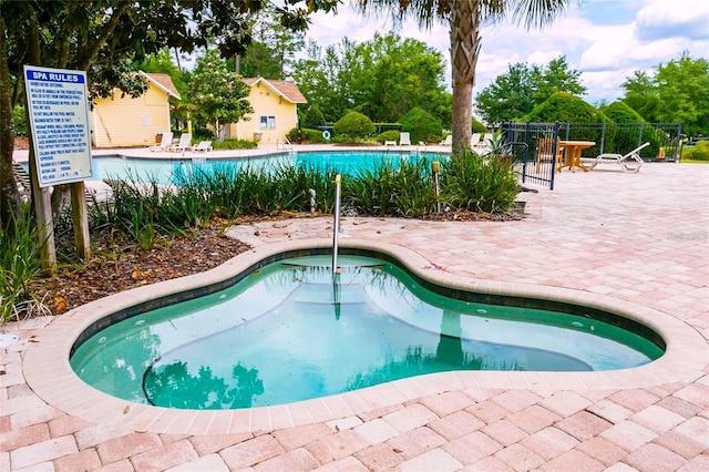 view of pool featuring a patio area