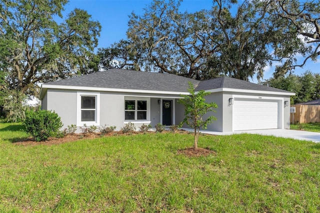 ranch-style home featuring a front lawn and a garage