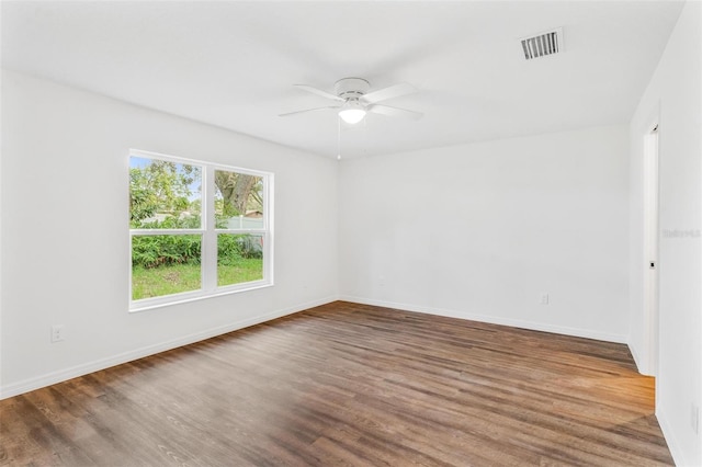 unfurnished room with ceiling fan and hardwood / wood-style floors