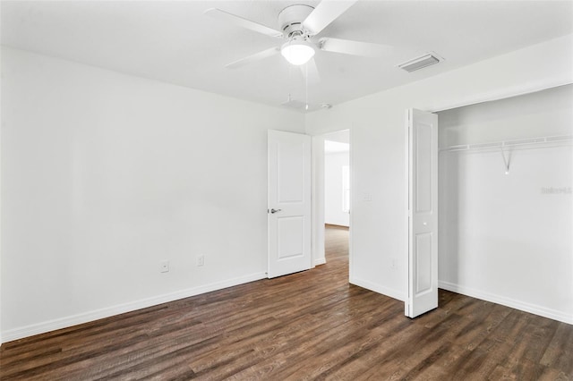 unfurnished bedroom with a closet, ceiling fan, and dark hardwood / wood-style flooring