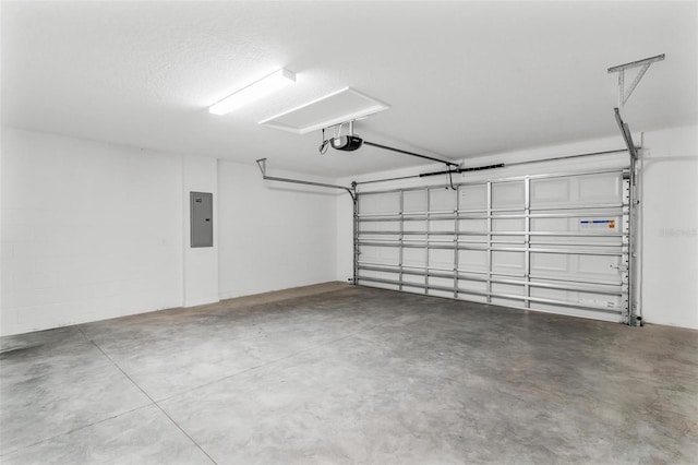 garage featuring a garage door opener and electric panel