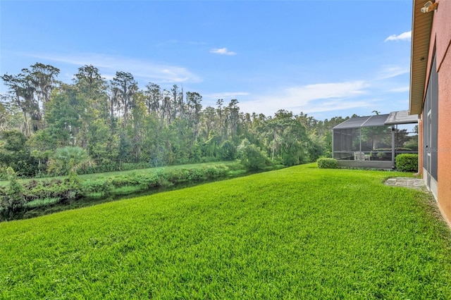 view of yard with a lanai