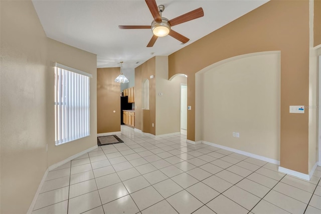 empty room with light tile patterned flooring and ceiling fan