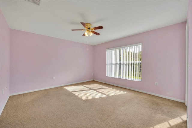 carpeted empty room with ceiling fan