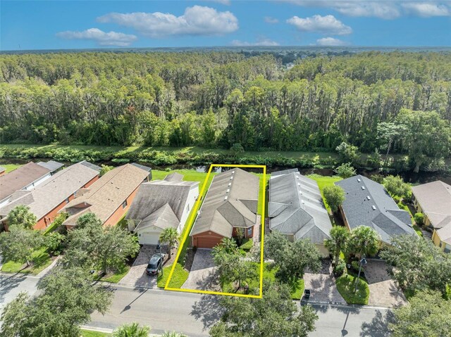 540 Grand Canal Dr, Kissimmee, FL 34759 - birds eye view of property featuring a forest view and a residential view