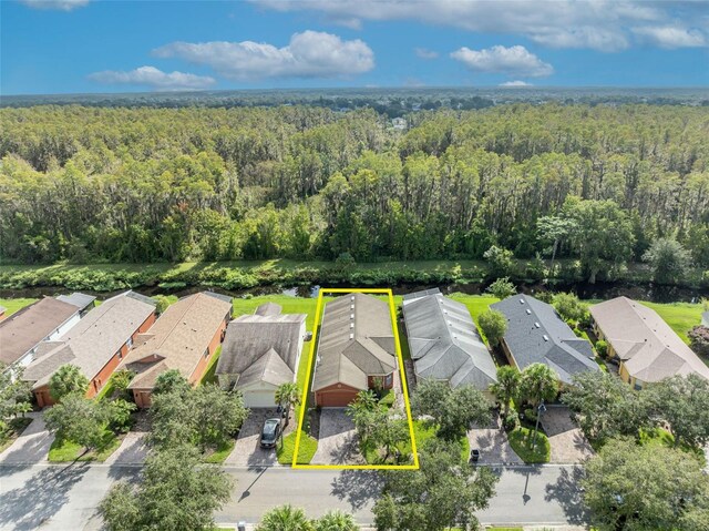 540 Grand Canal Dr, Kissimmee, FL 34759 - bird's eye view with a residential view and a wooded view