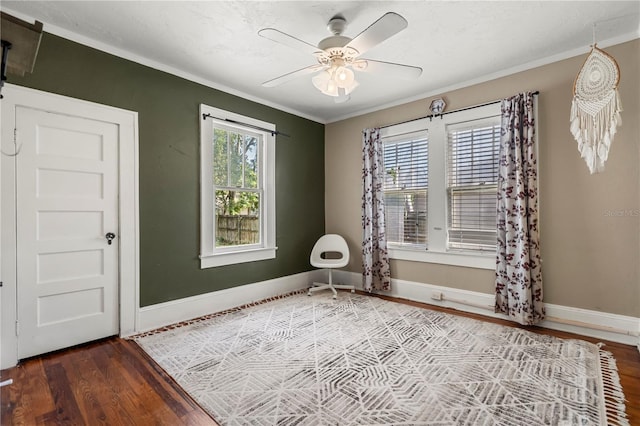 spare room featuring ceiling fan, crown molding, and dark hardwood / wood-style flooring