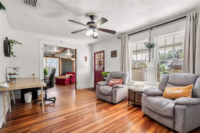 interior space with hardwood / wood-style flooring and ceiling fan