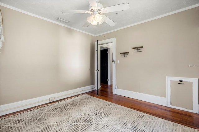 unfurnished room with ornamental molding, light wood-type flooring, and ceiling fan