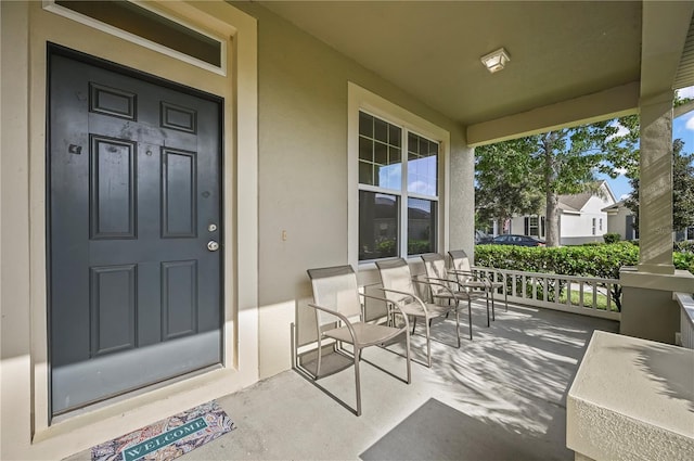 entrance to property featuring a porch