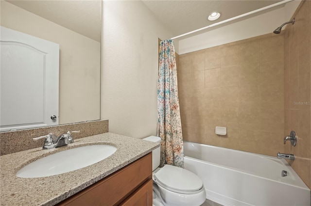 full bathroom featuring shower / bathtub combination with curtain, vanity, and toilet