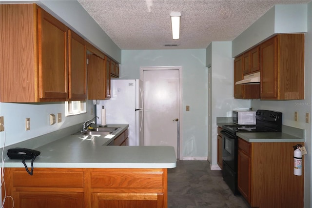 kitchen featuring visible vents, brown cabinetry, a sink, white appliances, and under cabinet range hood