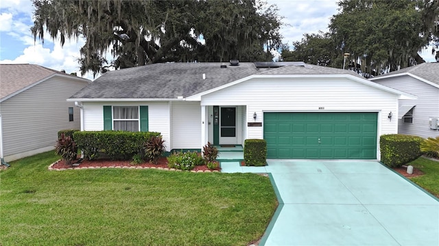 single story home featuring a shingled roof, a front yard, driveway, and an attached garage