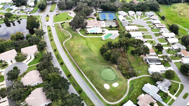 birds eye view of property with a residential view and a water view