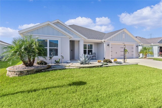 view of front of home with a garage and a front yard