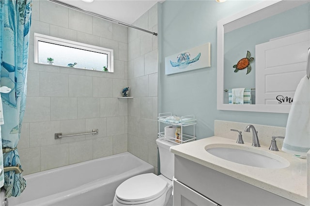 full bathroom featuring shower / tub combo with curtain, vanity, and toilet