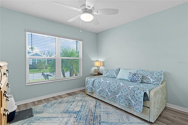 bedroom with ceiling fan and hardwood / wood-style floors