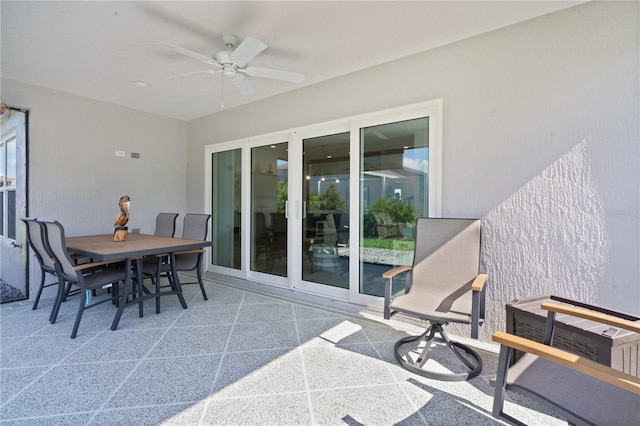 exterior space with ceiling fan