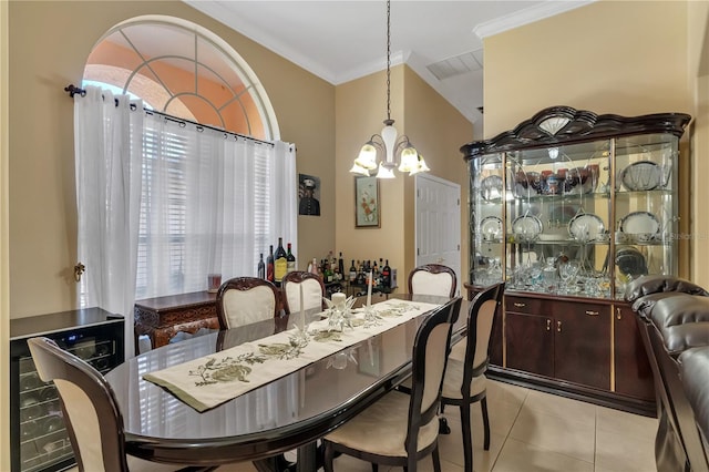 dining room featuring ornamental molding, an inviting chandelier, and light tile patterned floors