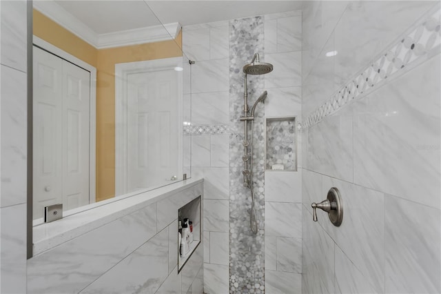 bathroom with a tile shower and ornamental molding