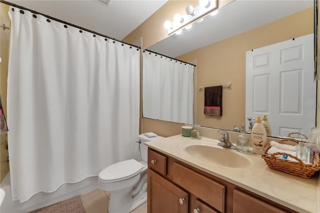 full bathroom featuring shower / tub combo with curtain, vanity, toilet, and tile patterned floors