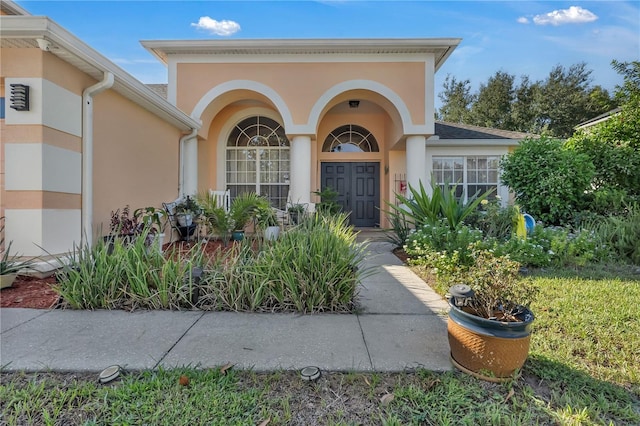 13129 Coldwater Loop, Clermont, FL 34711 - property entrance featuring stucco siding