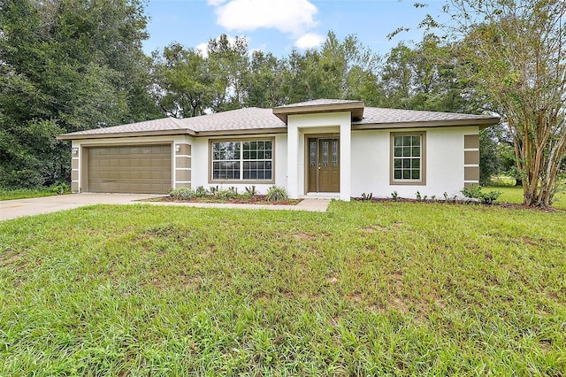 view of front facade featuring a front yard and a garage