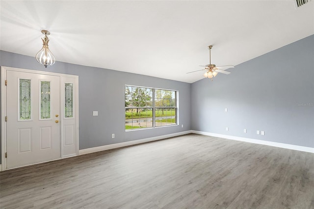 entrance foyer featuring lofted ceiling, ceiling fan, and hardwood / wood-style floors