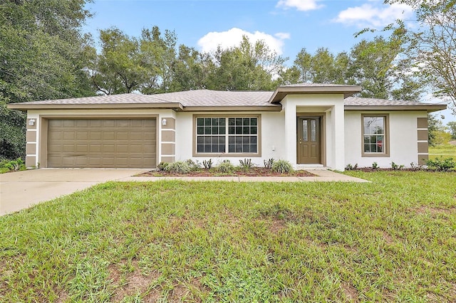 view of front of property with a front yard and a garage