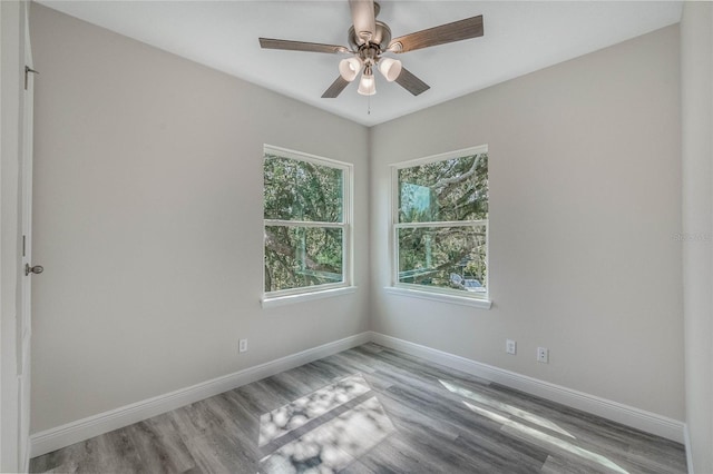 empty room with light hardwood / wood-style floors and ceiling fan