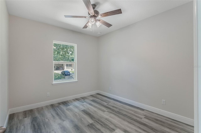 unfurnished room featuring light hardwood / wood-style floors and ceiling fan