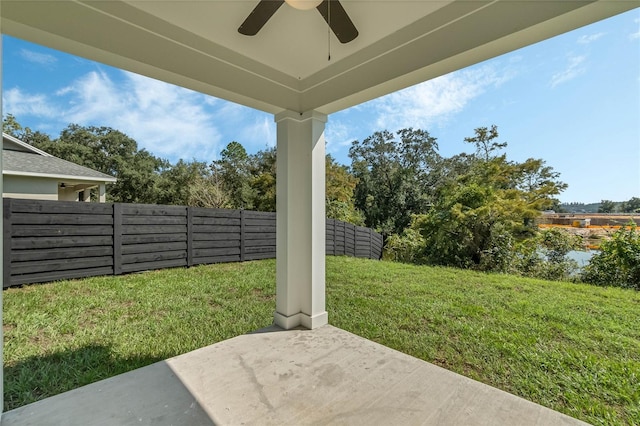 view of yard with a patio area and ceiling fan