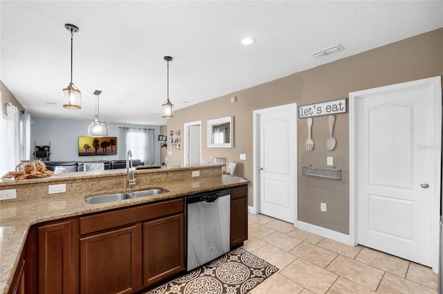 kitchen with light stone counters, dishwasher, plenty of natural light, and sink