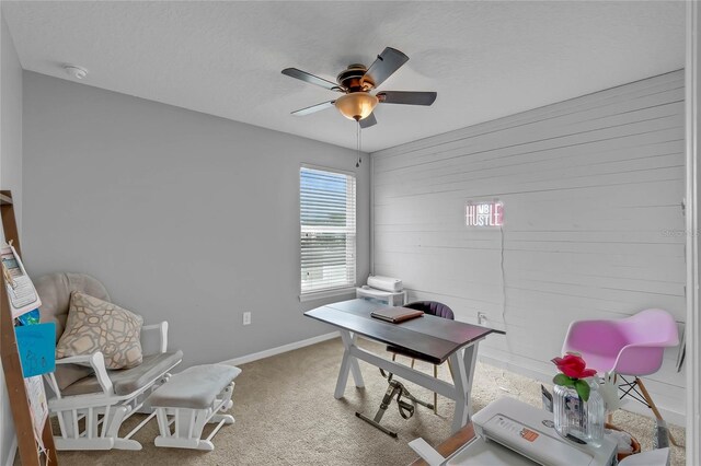 home office with ceiling fan and carpet floors