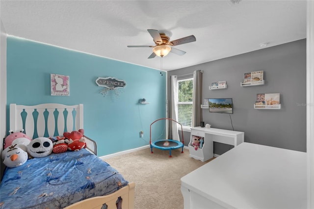 bedroom featuring ceiling fan and carpet