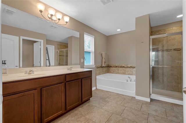 bathroom with tile patterned flooring, independent shower and bath, and vanity