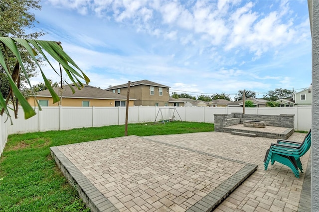 view of patio with an outdoor fire pit