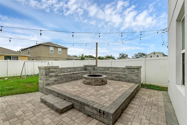 view of patio / terrace featuring a fire pit