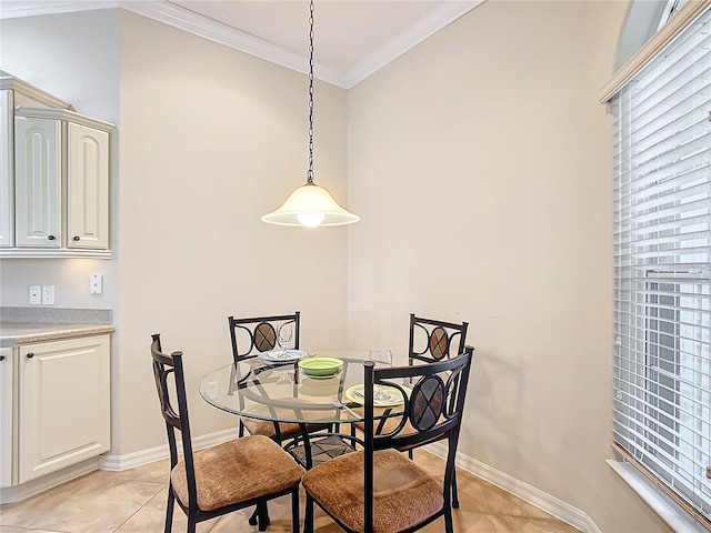 tiled dining area featuring crown molding and a wealth of natural light