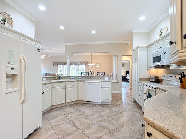 kitchen featuring pendant lighting, sink, ornamental molding, kitchen peninsula, and white appliances