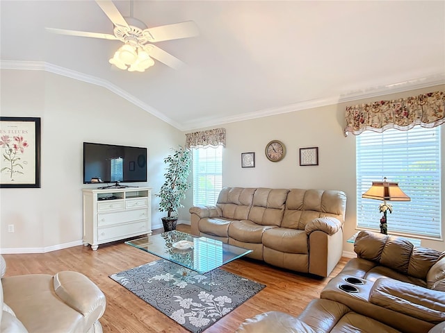 living room featuring vaulted ceiling, light wood-type flooring, ceiling fan, and crown molding