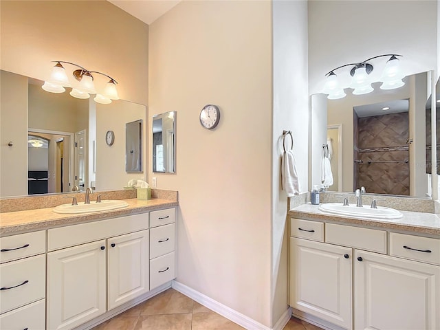 bathroom with vanity, tile patterned floors, and walk in shower