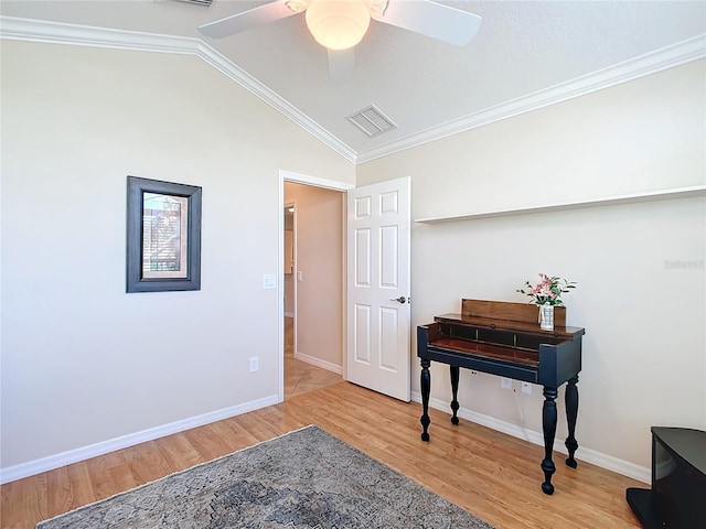 miscellaneous room featuring ceiling fan, lofted ceiling, hardwood / wood-style floors, and ornamental molding