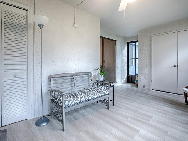 interior space with light hardwood / wood-style flooring and ceiling fan